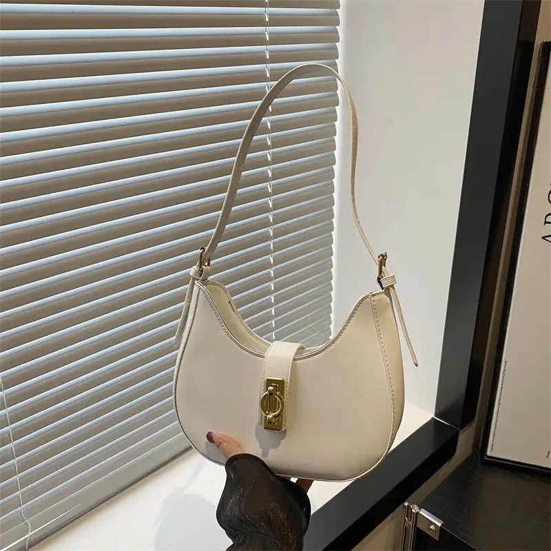 Women shoulder bag with gold claps